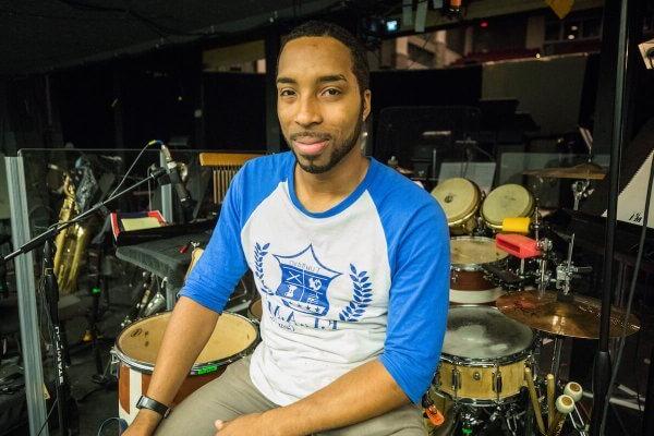 Daniel "D.K." Kelly '18 sitting in front of drum kit.